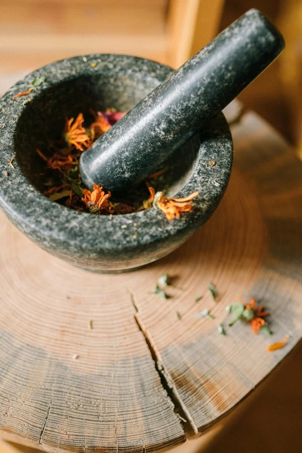 Traditional herbal medicine mortar with healing herbs